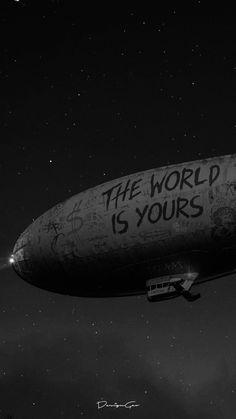 an old blimf with the words the world is yours written on it in black and white