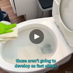 a person in green gloves is cleaning a white toilet with a rag on it and the words, those aren't going to devlop as fast either