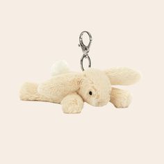 A mini bunny stuffed animal on a silver keychain. Bunny Jelly Cat Keychain, Cute Plushie Keychains, Jellycat Keychain Aesthetic, Jelly Cat Keychain, Jellycat Keychain, Stuffed Keychain, Y2k Items, Jelly Cat, Wishlist Ideas