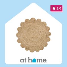 the logo for at home is shown in front of a blue background