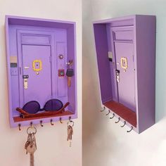 two purple lockers with keys hanging from them