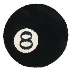 a black and white round rug with the number eight on it's center piece