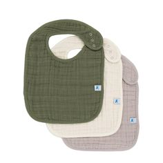 three bibs in different colors and designs on a white background, one with a green bib