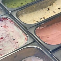 four trays filled with different types of ice cream