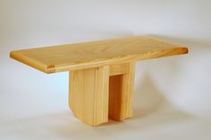 a wooden bench sitting on top of a white floor