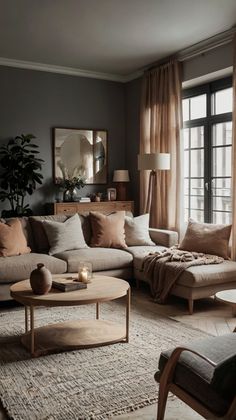 a living room filled with lots of furniture and pillows on top of a carpeted floor