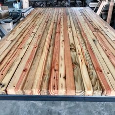 the back end of a truck with wood planks on it's flatbed