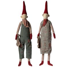 two dolls with red hats and overalls are standing next to each other on white background