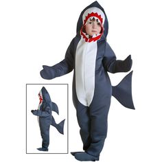 a little boy in a shark costume