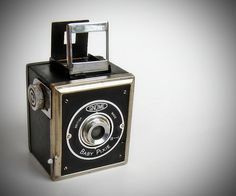 an old fashioned camera on a white background