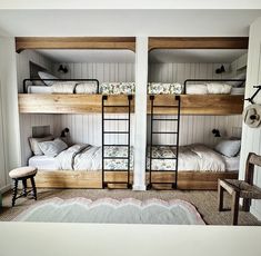 two bunk beds in a room with white walls