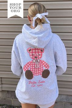 Shop our Plaid Teddy Sorority Hoodie, perfect for any sorority event, big little reveal or to wear everyday on campus! Find the best custom sorority apparel at University Tees today! Kappa Delta Teddy Bear, Pink Sorority Letters Sweatshirt, Sorority Merch Sweatshirt, Back Of Sweatshirt Designs, Sorority Hoodie Design, Sorority Christmas Shirts, Phi Mu Merch, Sorority Parents Weekend Shirts, Sorority Exec Sweatshirts