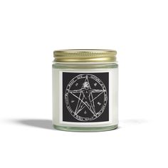 a white candle with a pentagramil on the lid and a black sticker