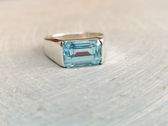 Aquamarine signet ring Gemstone details: Shape: emerald cut 8x12 mm Stone: aquamarine Metal: Solid silver Stone Color: blue Add this beautiful Ring in your accessories to make you feel unique. This ring have 925 stamp and you will receive a ring like the one in the picture. You can choose any size you want from drop down menu. We Accept Custom Order and Bulk Order Also, Feel free to contact me for any queries regarding custom or bulk order. See more items on my shop: https://www.etsy.com/shop/Ro Mens Aquamarine Ring, Mens Gemstone Rings Unique, Aquamarine Ring Men, Aquamarine Mens Ring, Green Aquamarine Ring For Gift, Emerald Cut Aquamarine Rings For Gift, Classic Aquamarine Rectangular Ring, Rectangular Aquamarine Ring For Gift, Aquamarine Wedding Ring