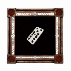 a wooden frame with two dices in it