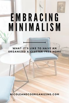 two blue chairs sitting in front of a window with the words embracing minimalism on it