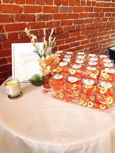 there are many donuts on the table for desserts to be served at this party