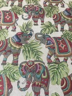 an image of elephants and palm trees on fabric