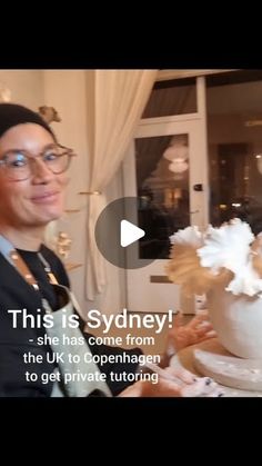 a man standing in front of a cake with frosting on it and the caption reads, this is sydney she has come from the uk to openhang to get private touring