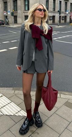 Grey suit, grey blazer, grey mini skirt, grey sweater, burgundy sweater over the shoulders, burgundy socks, burgundy bag Bottega Veneta, Prada loafers | Back to office outfits, back to work outfits, office outfits, corporate attire, fall outfits, autumn outfits Cute Thanksgiving Outfits, Lawyer Fashion, Burgundy Outfit, Autumn Fits, Blazer Outfit