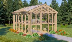 a small wooden greenhouse in the middle of a yard with flowers and plants around it