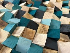 the wood is made up of many different colors and shapes, including black, blue, green, yellow, and brown