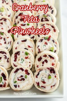 cranberry feta pinwheels on a platter with the title text overlay