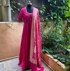 Hand embroidered Anarkali with banarasi bandhej dupatta / anarkali suit set / anarkali dupatta USA / khaddi georgette dupatta / Indian dresses/ voggish / pink anarkali dress          Looking for a perfect indian dress/anarkali/suit sets that are trendy, unique and easy to carry !! yess, You are at the right place. we carry such versatile pieces of anarkalis and suit sets that really let you stand out in any occassion !!      featuring this beautiful pure chanderi dress in pink color with hand em Anarkali Dress With Bandhani Dupatta, Georgette Embroidery Dress, Designer Chanderi Dupatta With Bandhani Print, Anarkali Style Bandhani Dupatta For Diwali, Silk Semi-stitched Bandhani Print Anarkali Set, Festive Art Silk Anarkali Set With Bandhani Print, Unstitched Bandhani Print Suit For Wedding With Traditional Drape, Anarkali Art Silk Dupatta With Bandhani Print, Festive Anarkali Dupatta With Bandhani Print