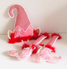 a red and white striped hat, booties and other items