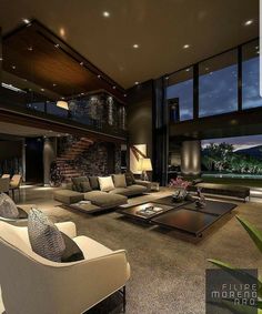 a living room filled with lots of furniture next to large windows and a fire place