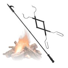 an image of a camp fire with tongs