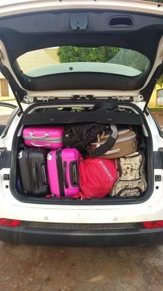 the trunk of a car filled with luggage