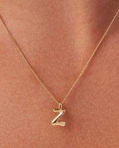 A best seller made better. Available in A through Z, these monograms are now available in a water-durable finish, with the option to strand multiple letters on a single chain. These custom letter pendants embrace a sculptural curve and smooth shape. Each letter is strung along a delicate curb chain that is adjustable to two different lengths (17"or 19") for your preferred fit. Finished in high-polish gold. To add an extra letter to your chain, see the Monogram Pendant. 14K gold ion plated steell Gold Necklace Letter, 14k Gold Ear Cuff, Z Pendant, Z Necklace, E Necklace, Gold Letter Pendants, Letter Necklace Initials, Gold Necklace Chain, Initials Necklace