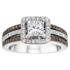 a white diamond ring with brown and white diamonds on the band, set in 18k white gold