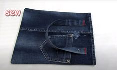 a pair of blue jeans folded on top of each other with the tag sew