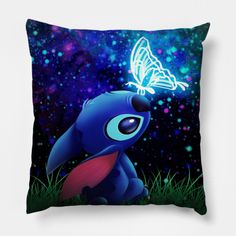 a blue and red pillow with a butterfly on it