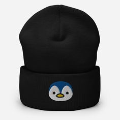 This Baby Penguin Beanie Cap is a must-have for any animal lover! With its charming embroidered design and hand-crafted details, this cuffed beanie will keep you warm and stylish. Made with high-quality materials, it's the perfect gift for any occasion. Embrace the flightless birds trend with this adorable hat. A snug, form-fitting beanie. It's not only a great head-warming piece but a staple accessory in anyone's wardrobe. • 100% Turbo Acrylic • 12″ (30 cm) in length • Hypoallergenic • Unisex s Black Novelty Beanie One Size Fits Most, Novelty Black Beanie, One Size Fits Most, Black Novelty Beanie, Black Embroidered Beanie, One Size Fits Most, Black Embroidered Beanie One Size, Black Embroidered Beanie Cap, Embroidered Black Hats As Gifts, Cute Black Beanie (one Size Fits Most), Cute Black Beanie (one Size)