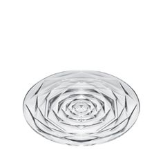 a clear glass bowl with an intricate design in the center on a white background photo