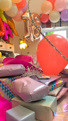 balloons and presents are piled on top of each other