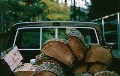 a truck with logs in the back bed