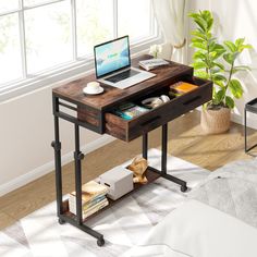 a laptop computer sitting on top of a wooden desk next to a plant in a living room