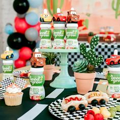 a table topped with cupcakes and desserts