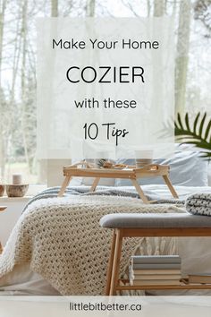 a bed with white sheets and blankets on it in front of a window that reads make your home cozyer with these 10 tips