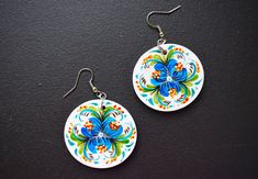 Folk art earrings. Wooden painted earrings. Painting done with acrylic paints and acrylic lacquer coated for durability and shine. Earrings are very light and not heavy for your ear. Diameter 4 cm (1.6 inches) Thickness 3 mm (0.12 inch) White Hand-painted Flower-shaped Jewelry, White Hand Painted Flower Jewelry, Hand Painted White Flower Jewelry, Artistic White Drop Earrings, Artsy White Earrings, Artsy White Pierced Earrings, Artsy White Drop Earrings, Artistic Hand Painted White Earrings, Artistic White Round Earrings