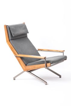 a chair that is made out of wood and grey fabric