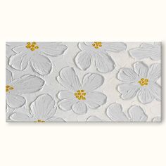 white and yellow flowers are painted on the wall