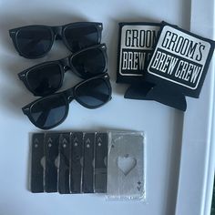 the sunglasses are on display next to some cards and other items that have been placed around them