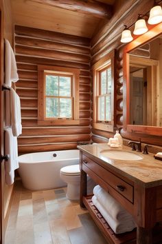 a bathroom with a tub, toilet and sink