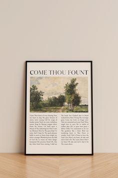 a book page with the title'come thou fountain'on it, sitting on top of a wooden table