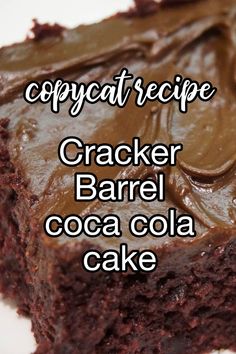 a close up of a piece of cake with chocolate frosting on it and the words copycat recipe cracker barrel cocoa cola cake